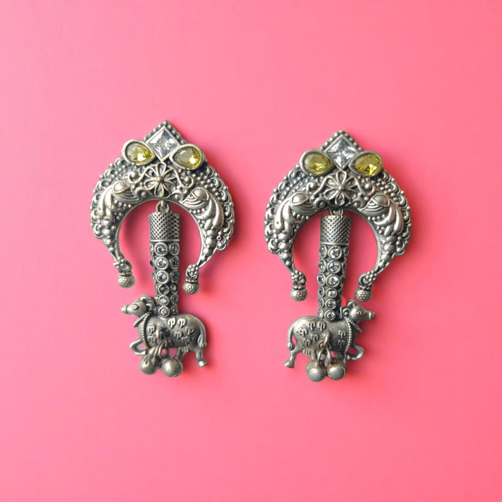 Brass construction supports the antique oxidised finish of this tusk earring.