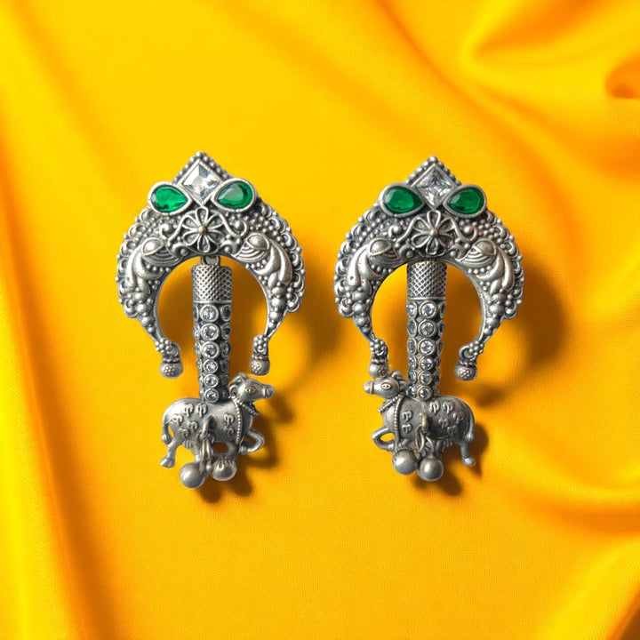 Oxidised texture highlights the tribal-inspired shape of this earring.