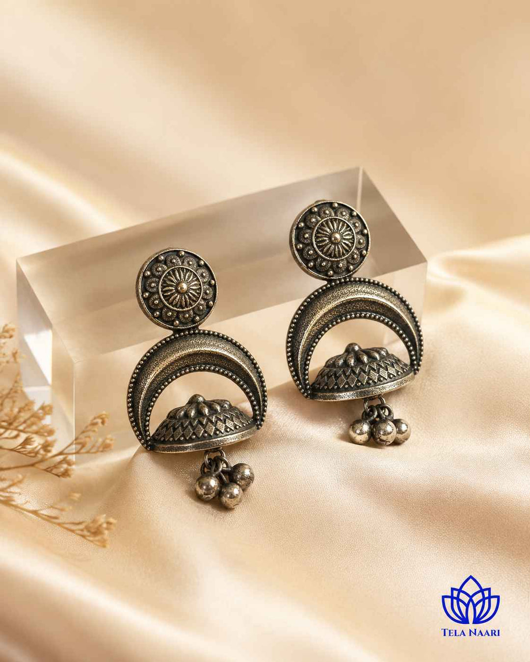 Oxidised finish gives this earring a textured antique surface.