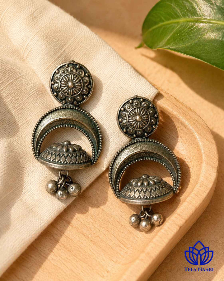 Half-moon dome shape defines the silhouette of this earring.