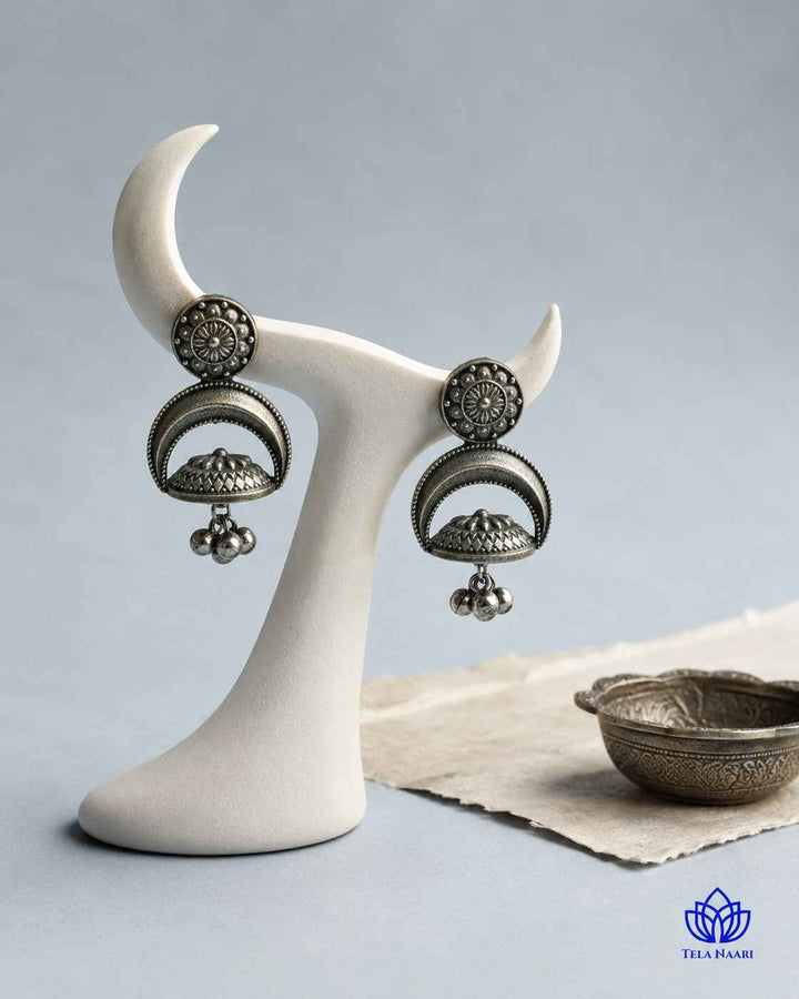 Crescent silhouette highlights the earring&