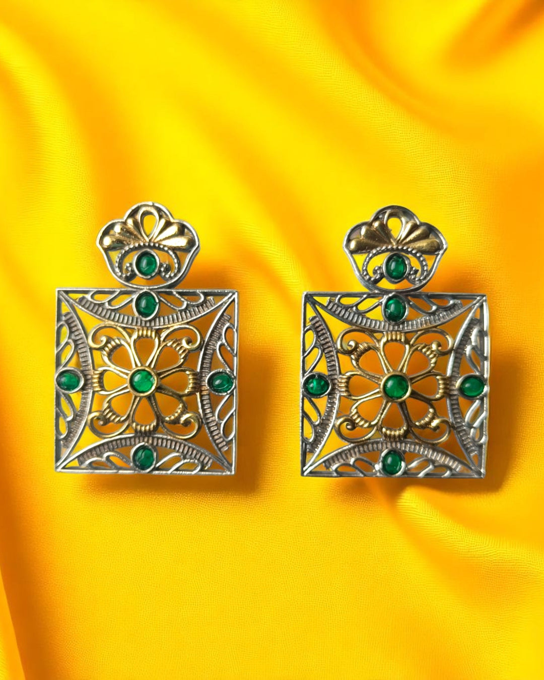 Layered plating creates dimension across this geometric square earring.