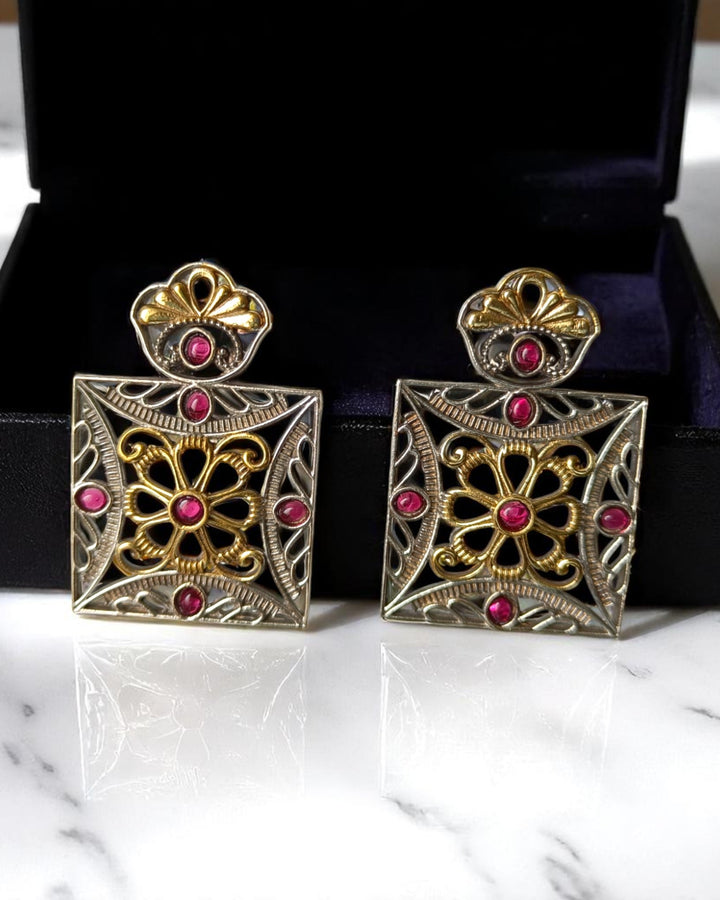 Square silhouette anchors the geometric design of this earring.