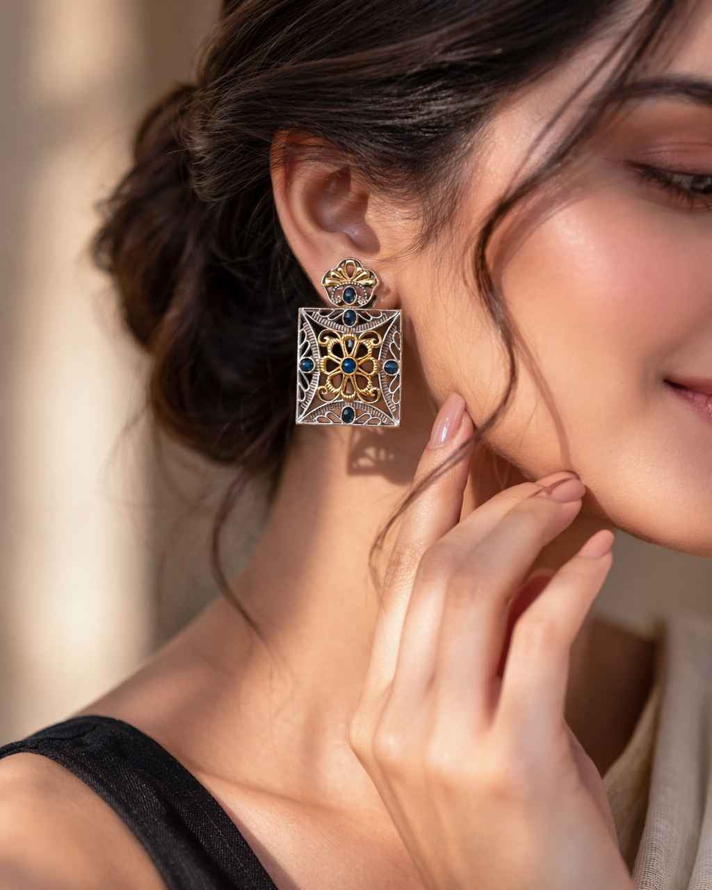 Structured square shape defines the silhouette of this earring.