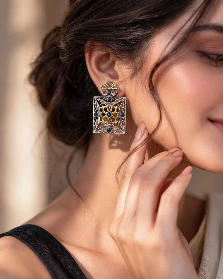 Structured square shape defines the silhouette of this earring.