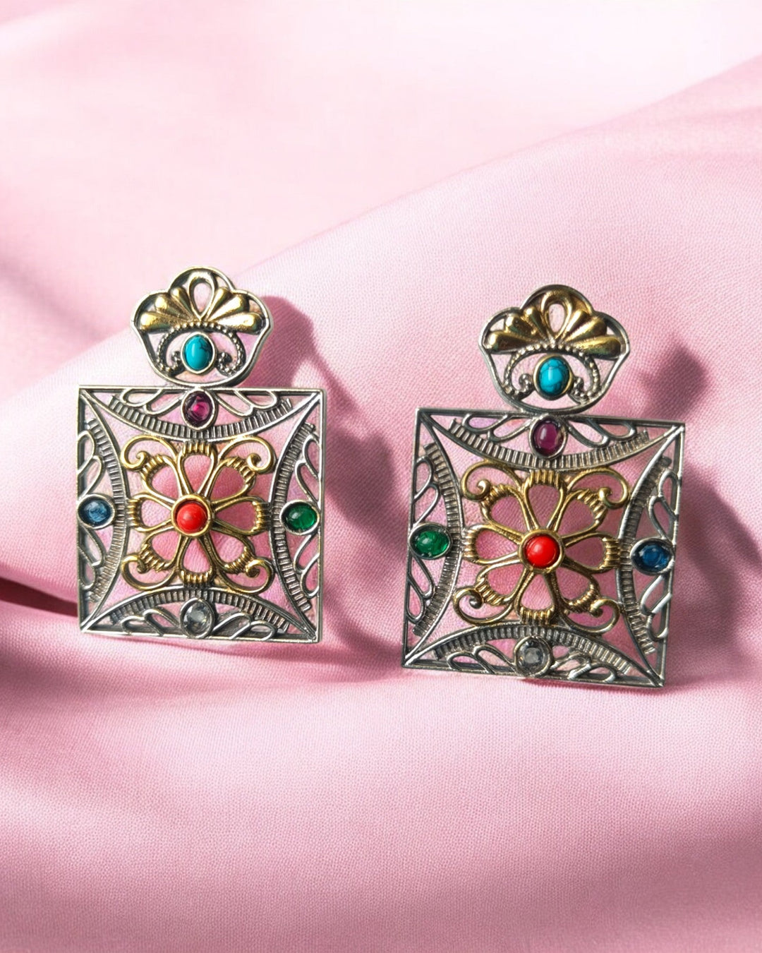 Vibrant dual-tone finish gives this square earring its bold contrast.