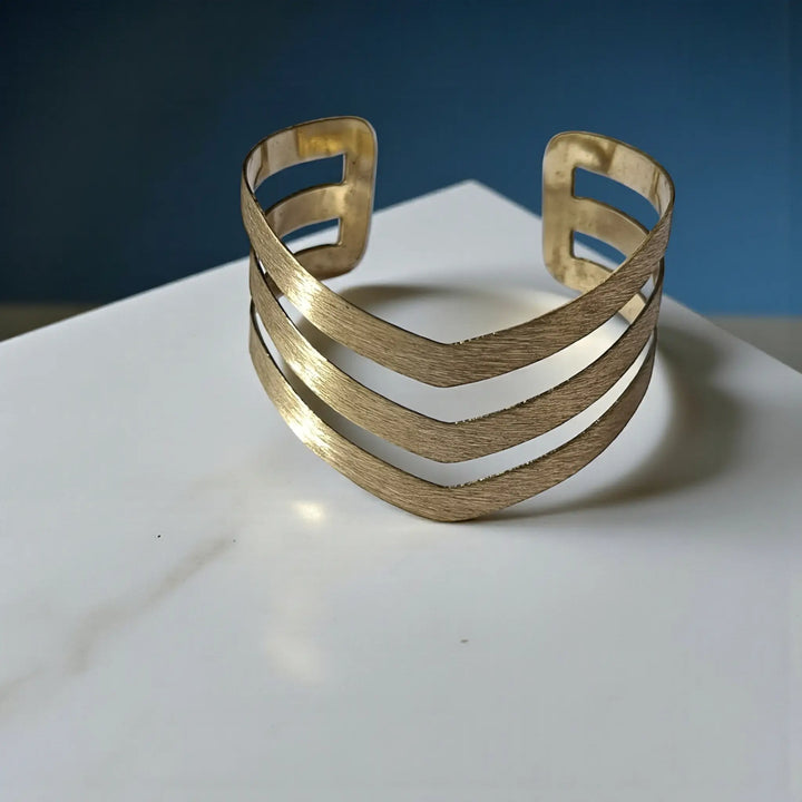 Anti-tarnish chevron cutout brass cuff bracelet for women featuring handcrafted boho-inspired design and golden finish
