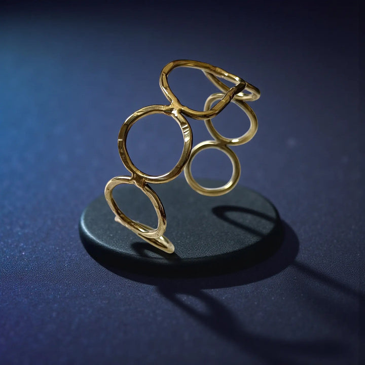 Eternal Echo anti-tarnish cuff bracelet for women featuring graceful curved design and polished golden shine
