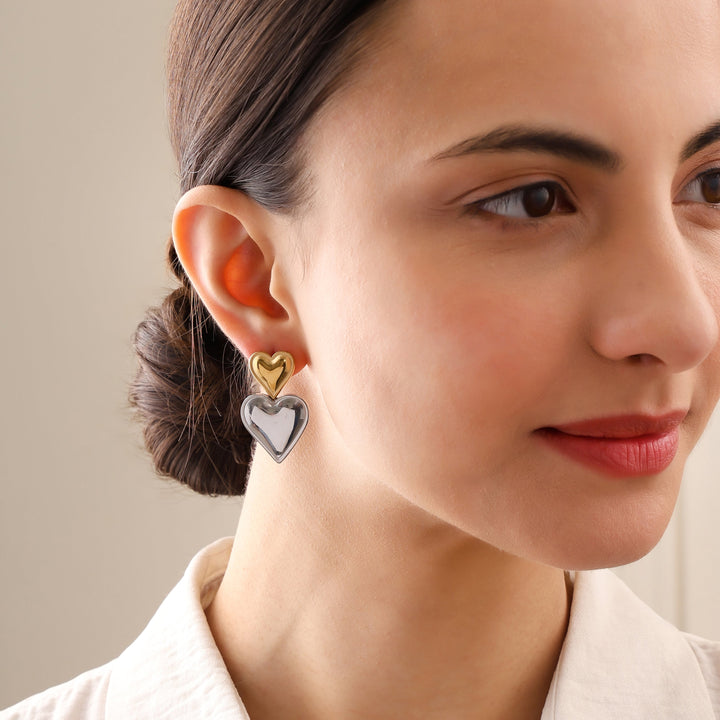 Compact heart stud earring features a tarnish-resistant gold finish.