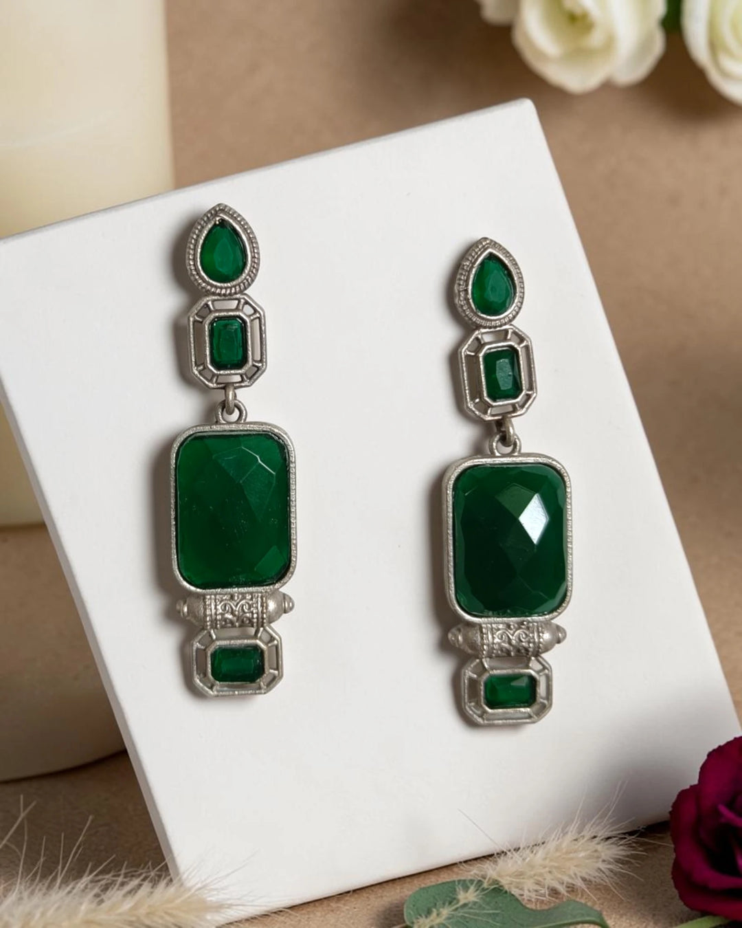 Layered geometric tiers shape the silhouette of this drop earring.