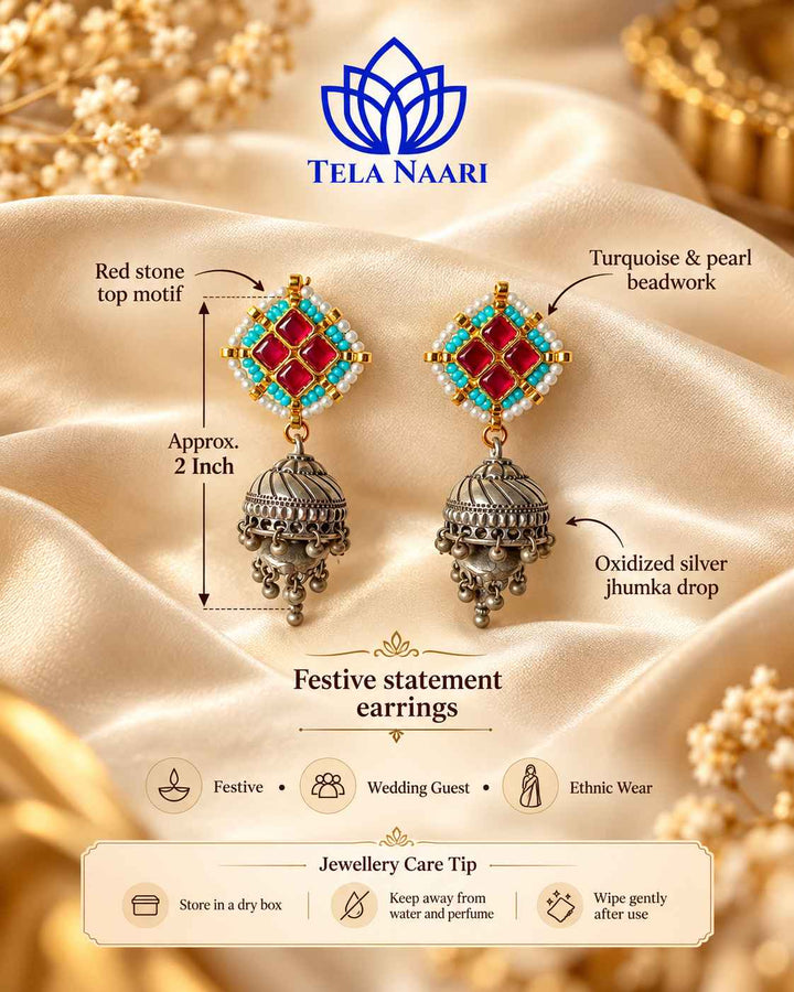 Artificial stone detailing highlights the centre of this jhumka.