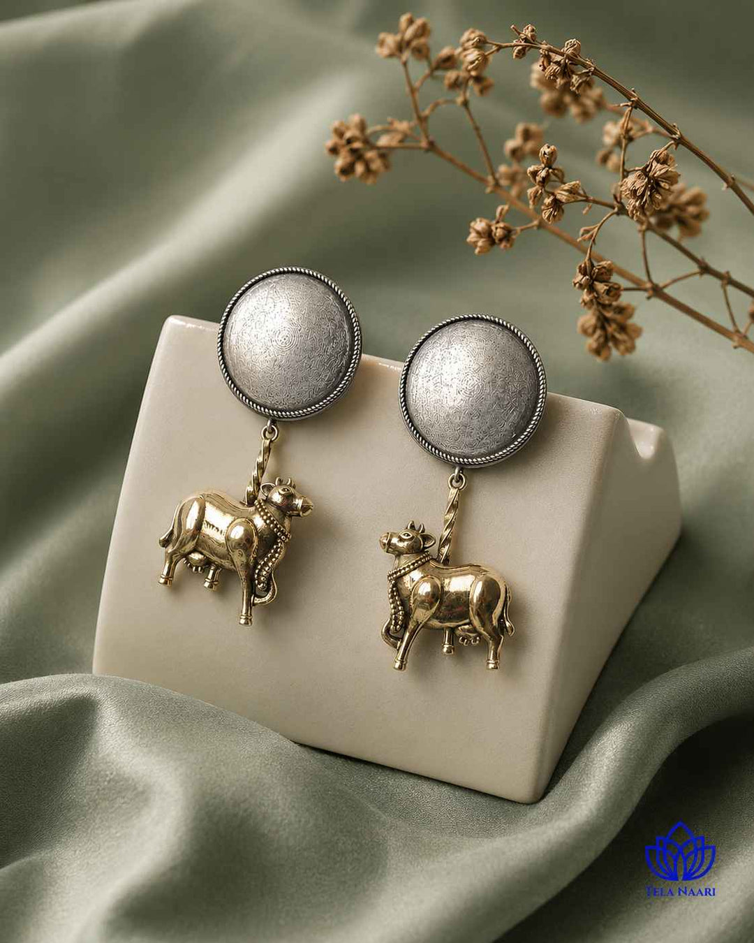 Silver polish gives this earring a dual-tone plated finish.
