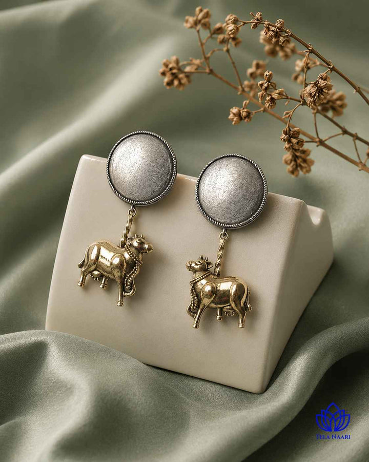 Silver polish gives this earring a dual-tone plated finish.