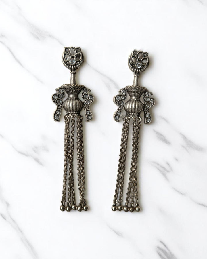 Oxidised brass finish gives these chain earrings their antique texture.