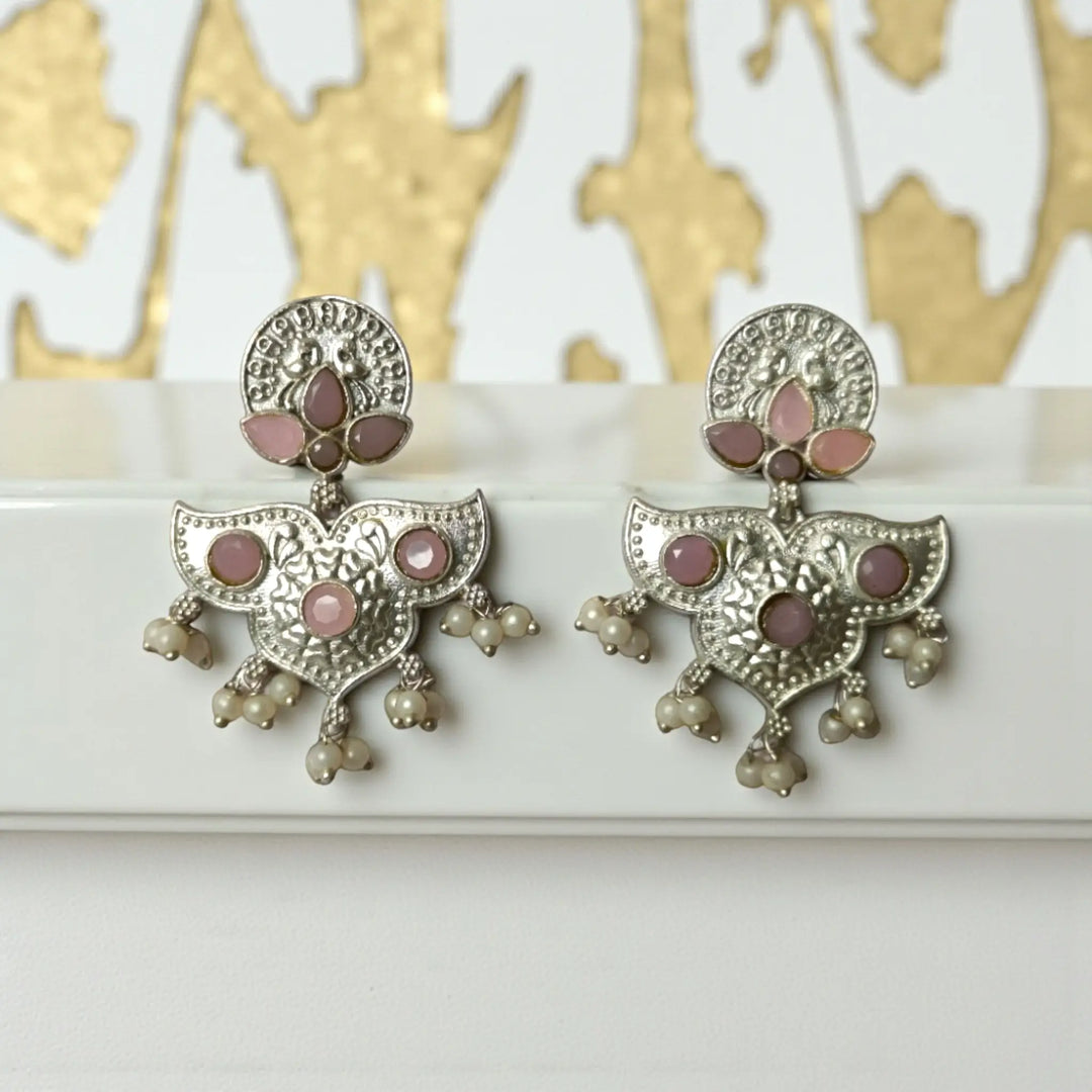 Blue accent brings colour to this silver oxidised earring.