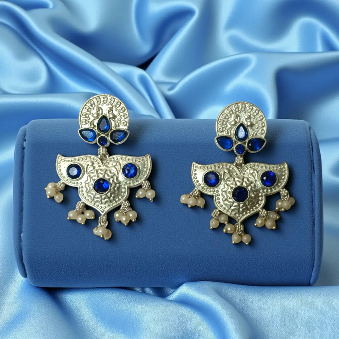 Sky blue tone highlights the oxidised finish of this earring.