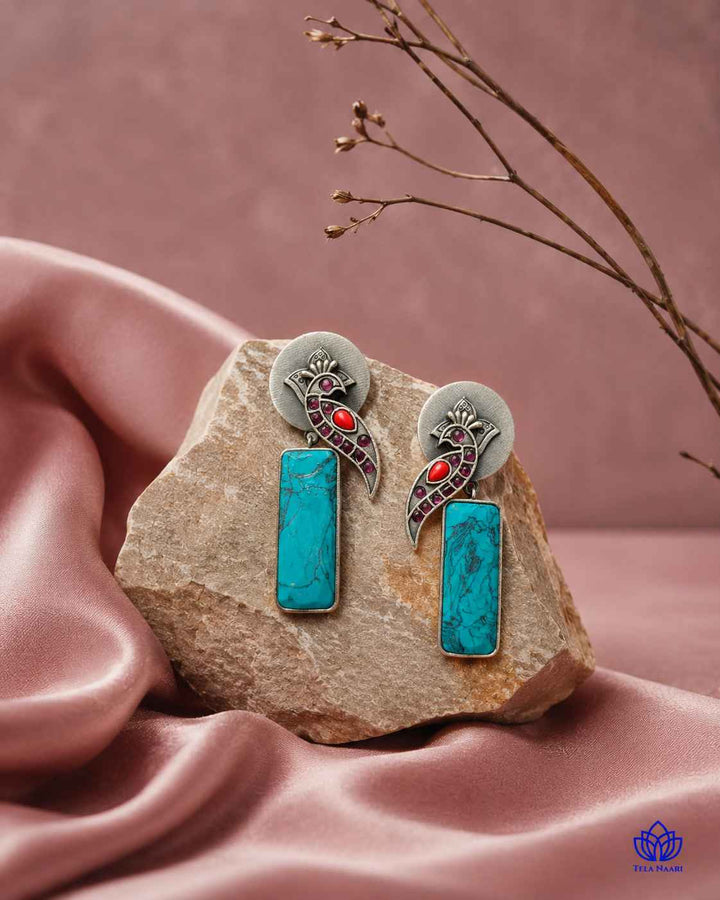 Glass bead accents add texture to this silver-plated earring.