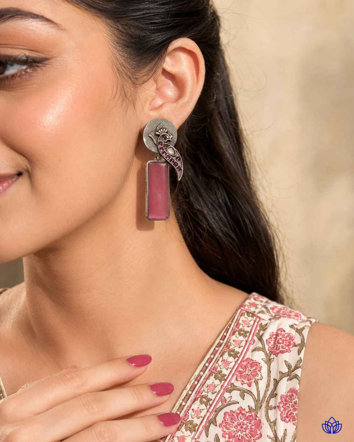 Post and back closure secures this silver-plated earring in place.