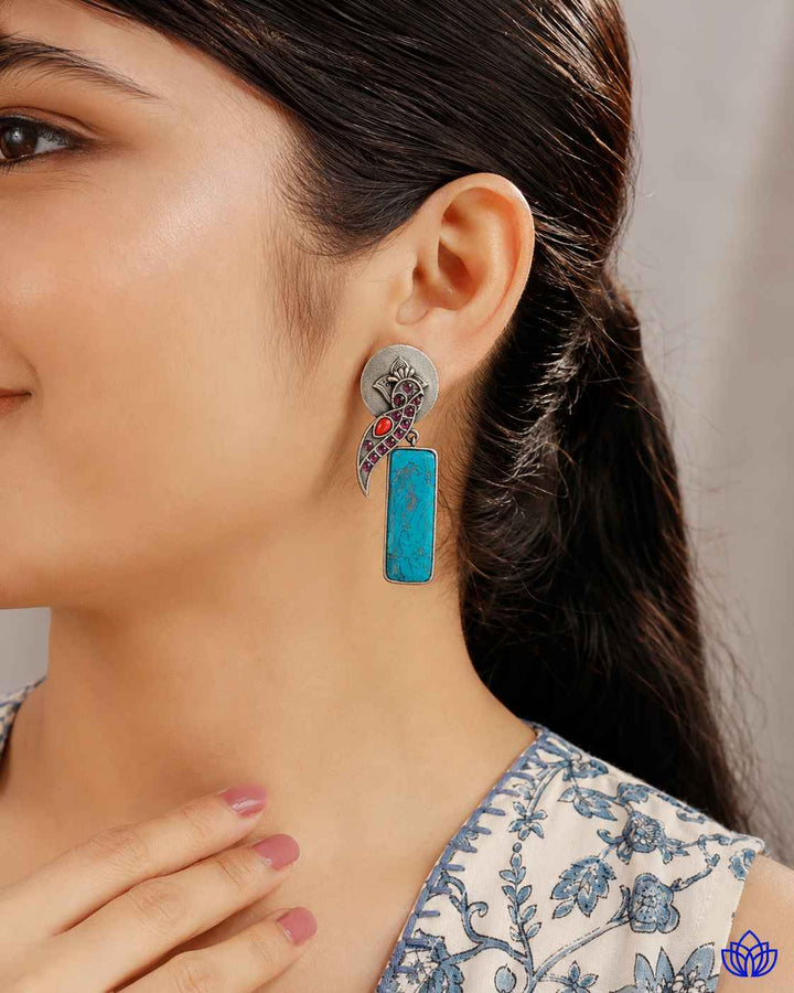 Post and back closure secures this silver-plated earring in place.