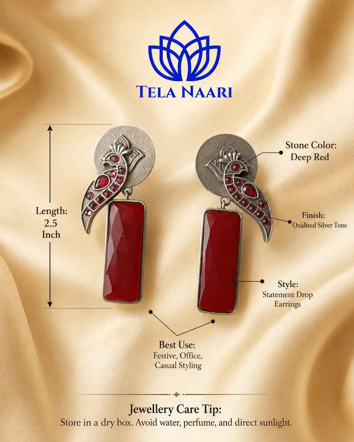 Artificial stone accents highlight the intricate texture of this earring.