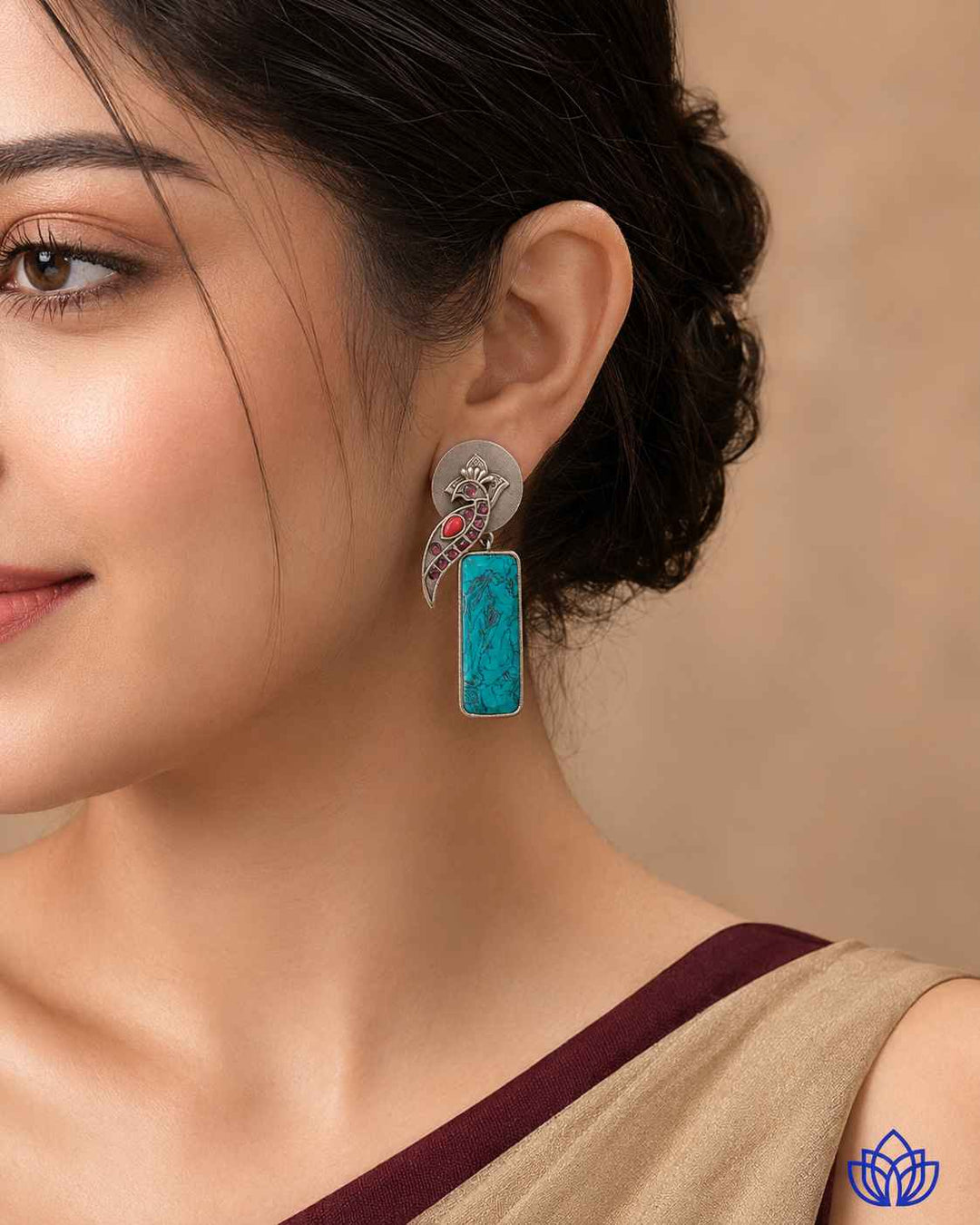 Silver-plated finish covers the surface of this handmade earring.