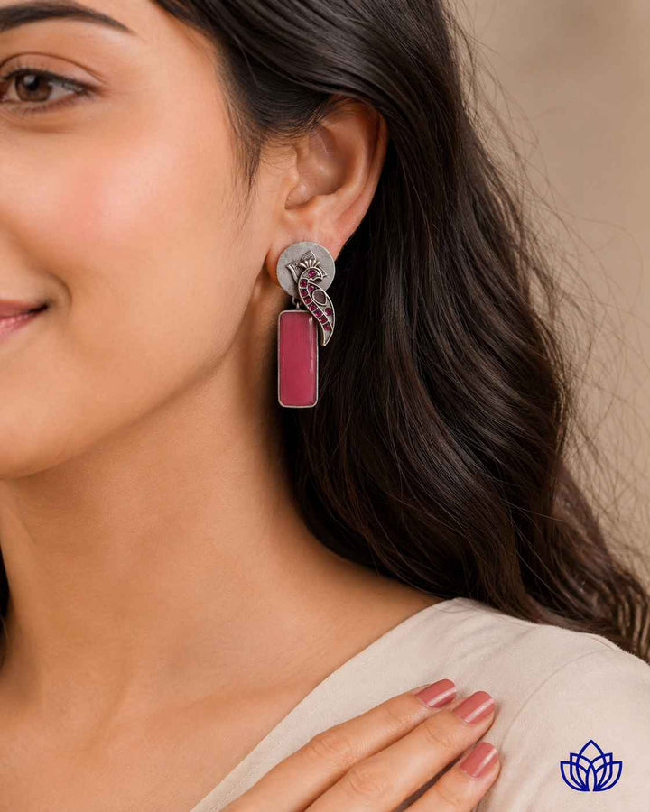 Striking beadwork highlights the pink and silver colour combination.