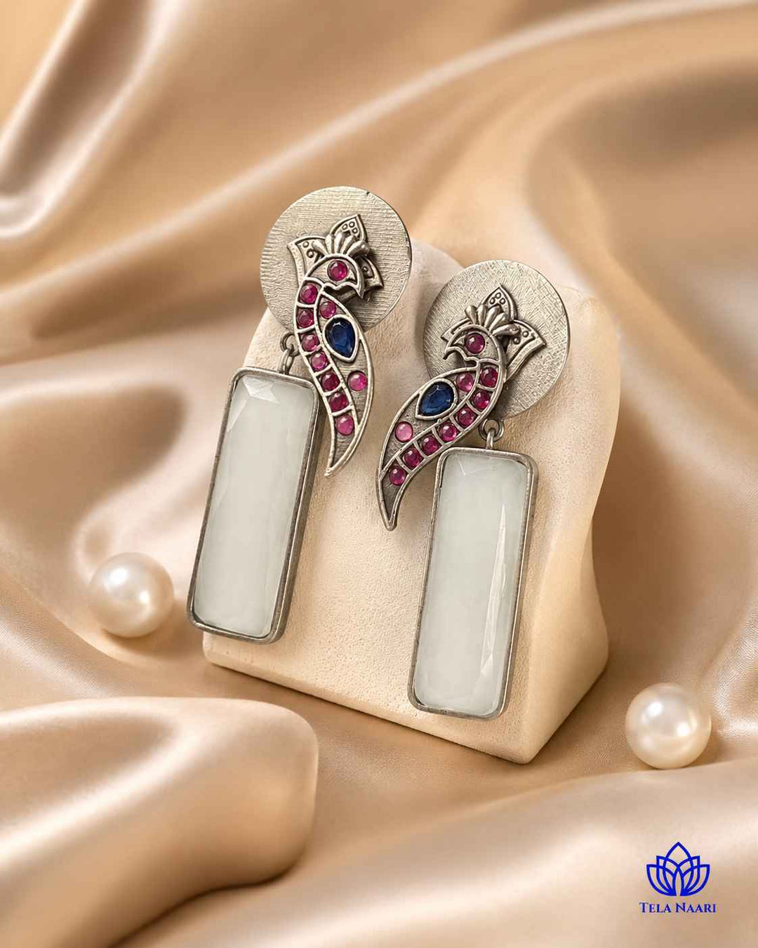 Textured surface combines glass beads with white stone detailing.