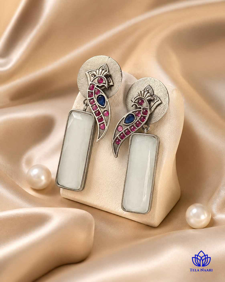 Textured surface combines glass beads with white stone detailing.