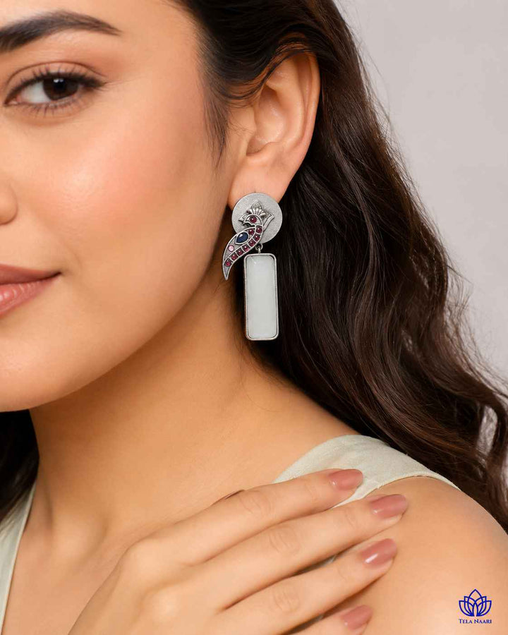Versatile design pairs a silver-plated finish with white stones.