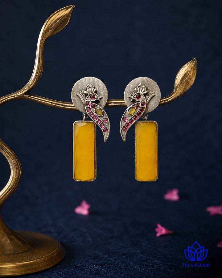 Textured surface combines glass beads with yellow stone detailing.