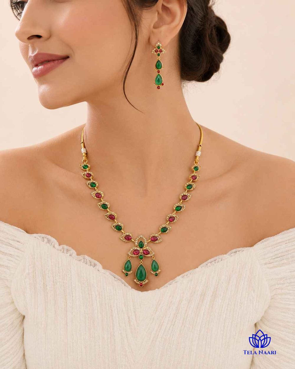 Red and green stones decorate the surface of this necklace.
