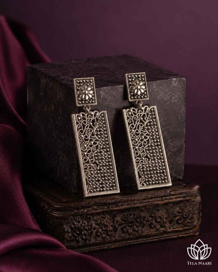 Push-back closure secures this silver-plated teardrop earring crafted in brass.