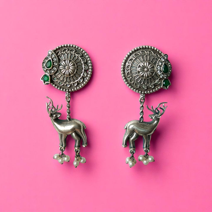 Deer charm dangles from this silver oxidised brass earring design.