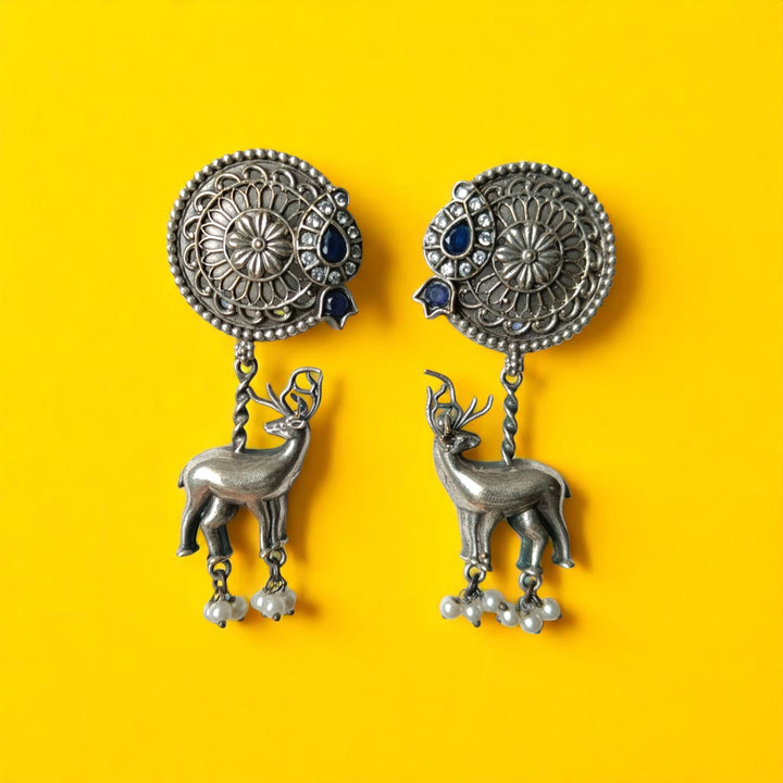 Brass construction supports the oxidised silver finish of this deer earring.