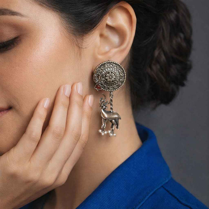 Yellow accent brings colour to this silver oxidised deer charm earring.
