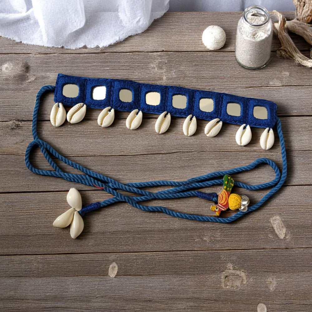 Mirror work catches the light across this blue fabric choker.