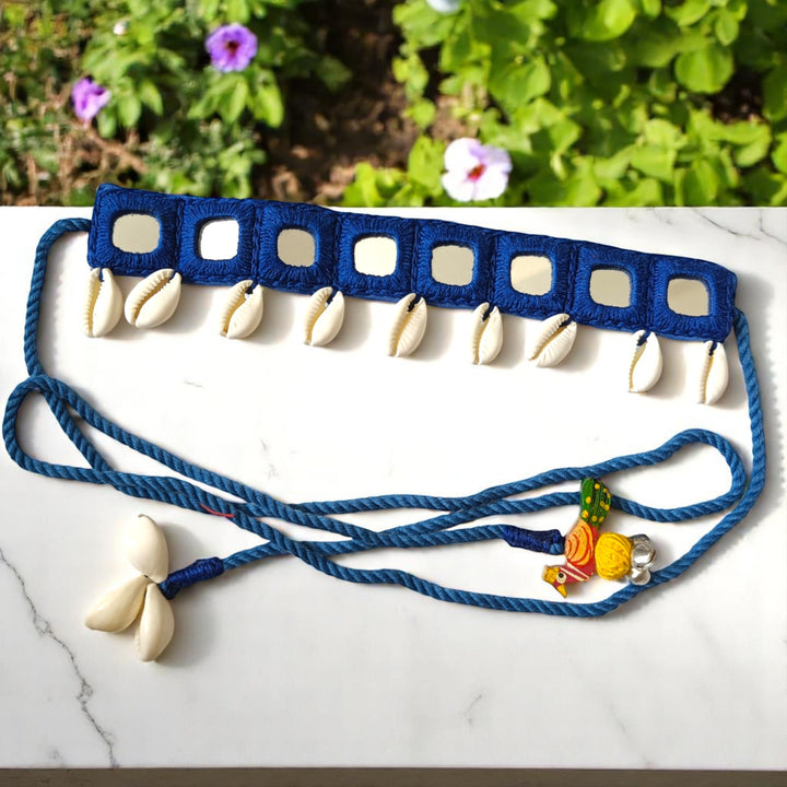 Traditional thread tie-up secures this blue fabric choker.