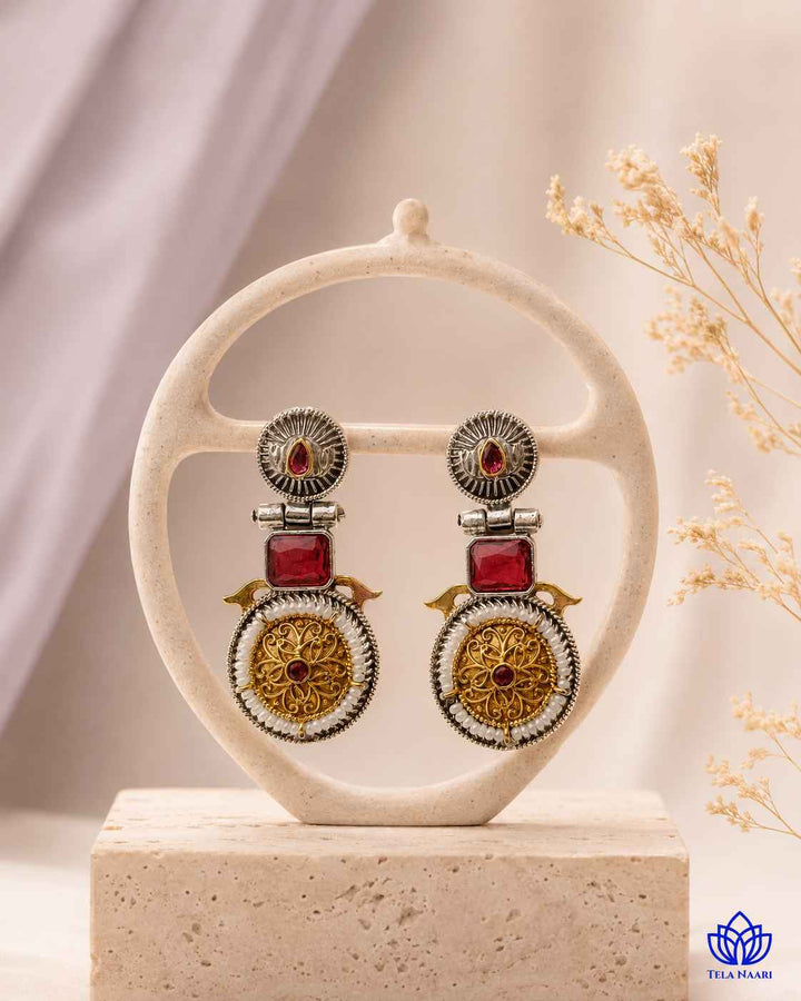 Bold silhouette defines the statement design of this earring.
