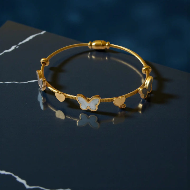 Cute butterfly and heart charm hand bracelet for girls with anti-tarnish coating and minimal chic design
