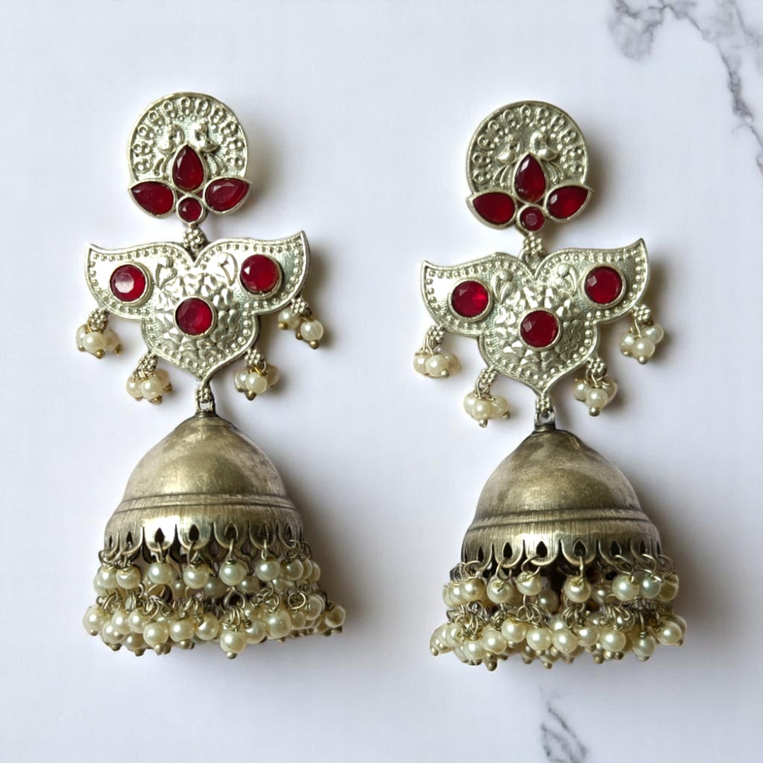 Delicate oxidised craftsmanship highlights the statement design of this earring.
