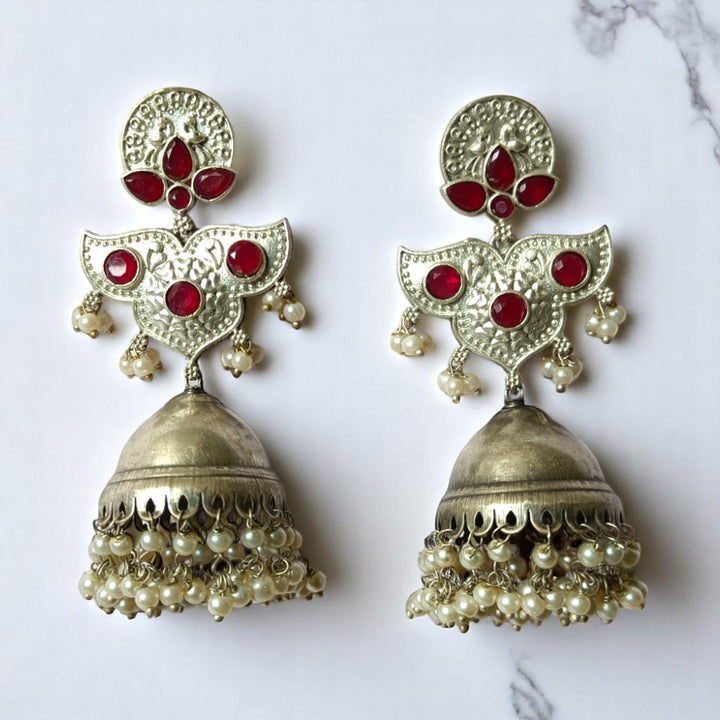 Delicate oxidised craftsmanship highlights the statement design of this earring.