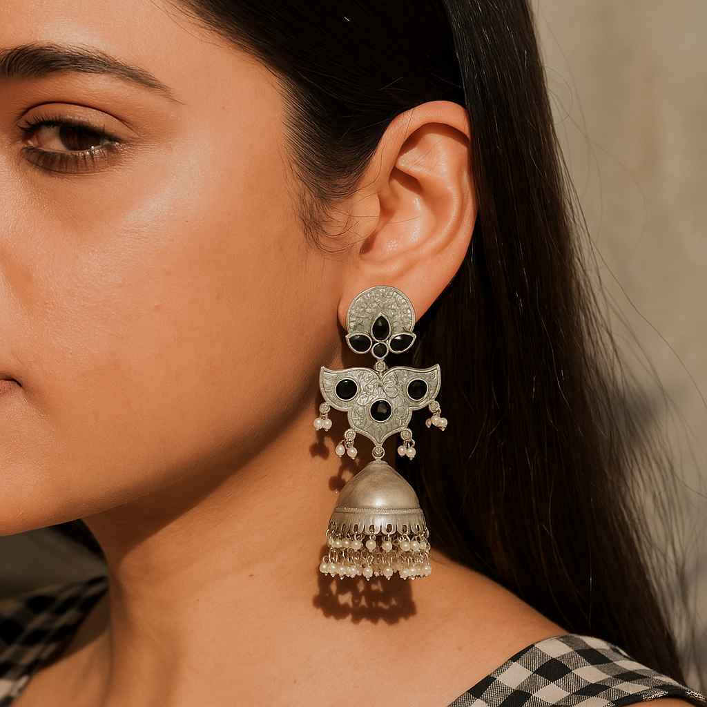 Statement silhouette defines the bold shape of this oxidised earring.