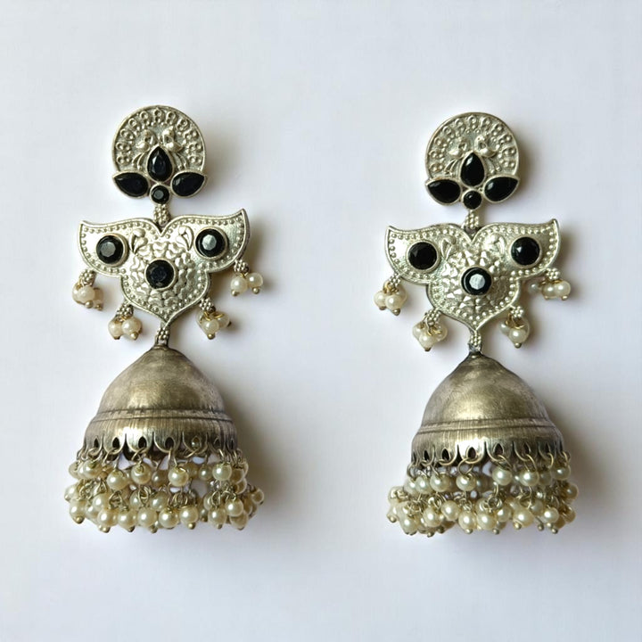 Intricate oxidised detailing covers the surface of this statement earring.