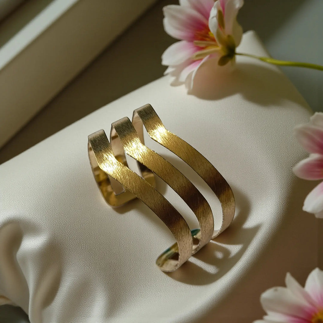 Chevron cutout anti-tarnish hand bracelet for women with artisanal brass detailing and open cuff style
