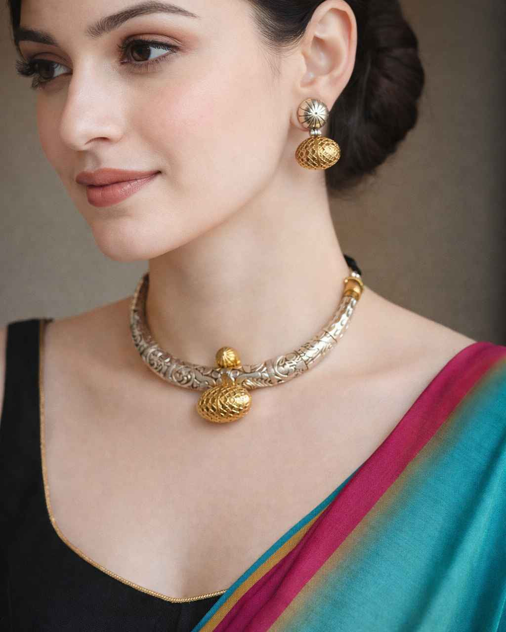 Handcrafted chitai work brings antique detailing to this oxidised necklace set.