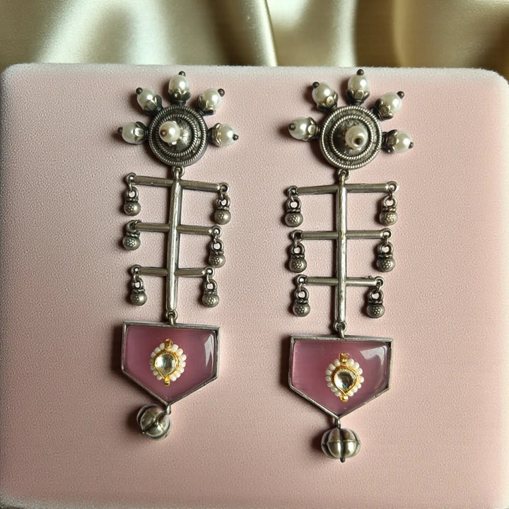 Ayushka oxidised silver earrings in pink — romantic evening wear and wedding functions; handcrafted detailing for statement festive looks.

