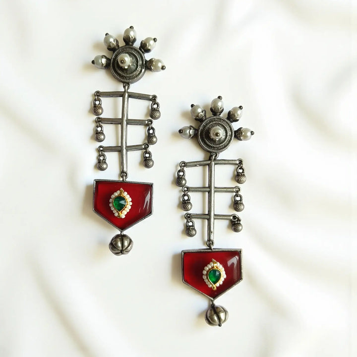 Ayushka oxidised silver earrings in red — ideal for sangeet, festive parties, and bold ceremonial attire with rich ethnic accents.

