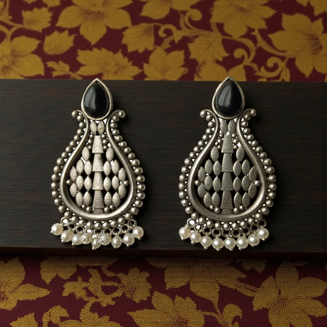 Umeshwari oxidised silver pearl earrings with black stones — crafted for bold evening looks and elegant indo-western outfits.
