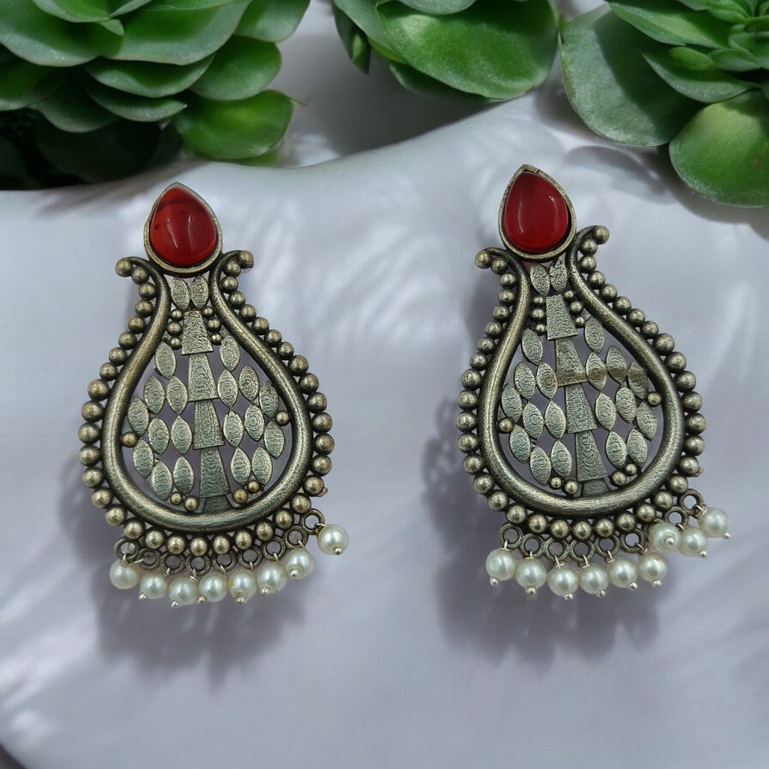 Umeshwari oxidised silver pearl earrings with red pearls — made for festive parties, traditional attire, and evening celebrations.
