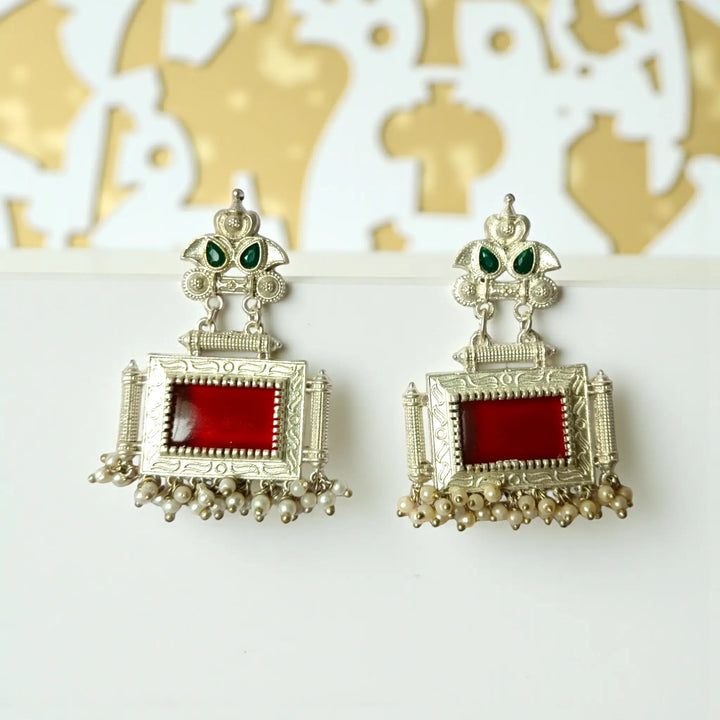 Bharati oxidised silver pearl earrings with red pearls — bold choice for traditional sarees, receptions, and evening celebrations.
